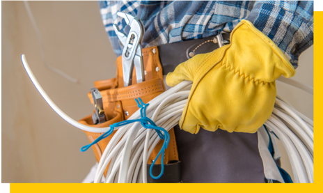 electrician holding bundle of cable